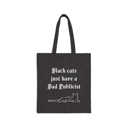 Laying cat tote bag