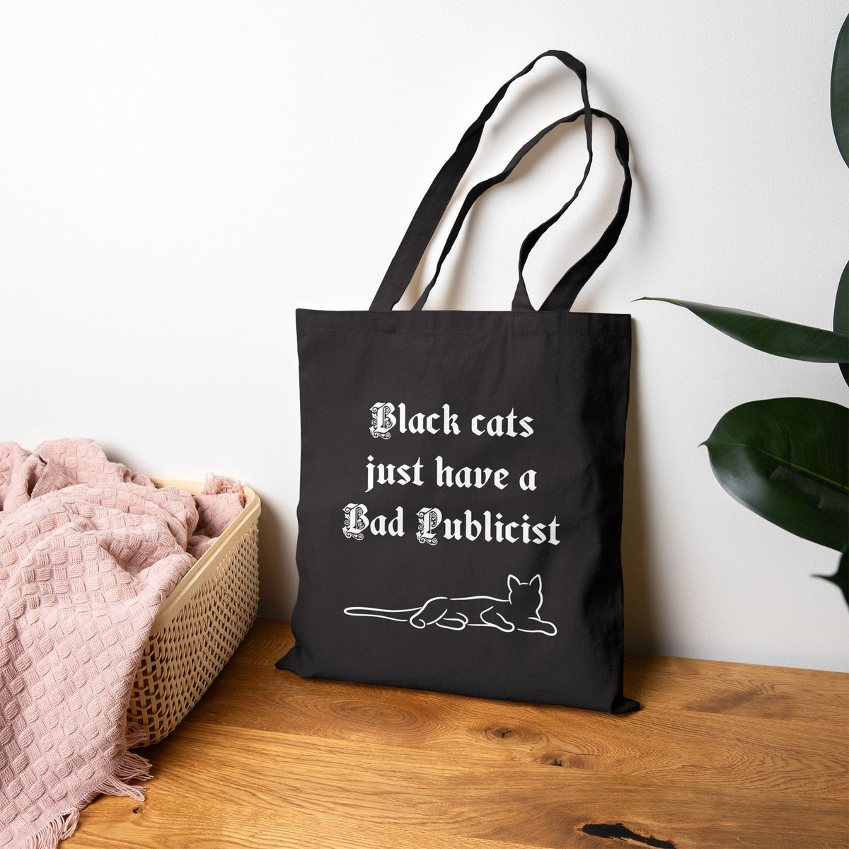 Laying cat tote bag